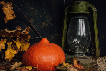  Halloween background. Molten candles. Carrying out the ritual.  Halloween in rustic style. Autumn mood. All hallows' day. Pumpkin, lamp, candles. Harvest. Countryside.