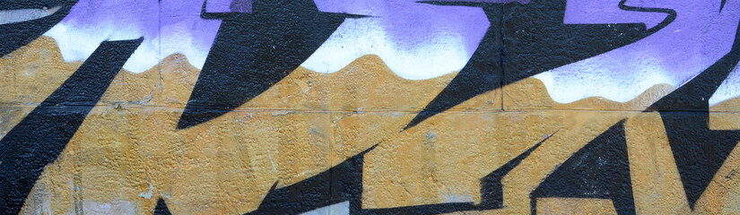 Wall Mural - Fragment of graffiti drawings. The old wall decorated with paint stains in the style of street art culture. Colored background texture in purple tones