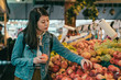 © PR Image Factory - woman picking apples in original farmers market