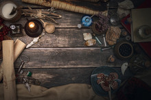 Wizard Table With Various Magic Accessories And Ingredients. Witchcraft. Herbal Alternative Medicine.