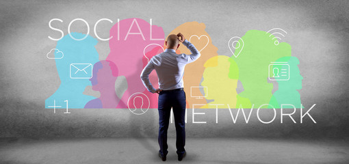 Poster - Businessman in front of a colorfull social network teamwork with icon 3d rendering