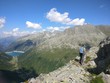 © Janin - Hiking girl with backpack enjoying the view from the mountains