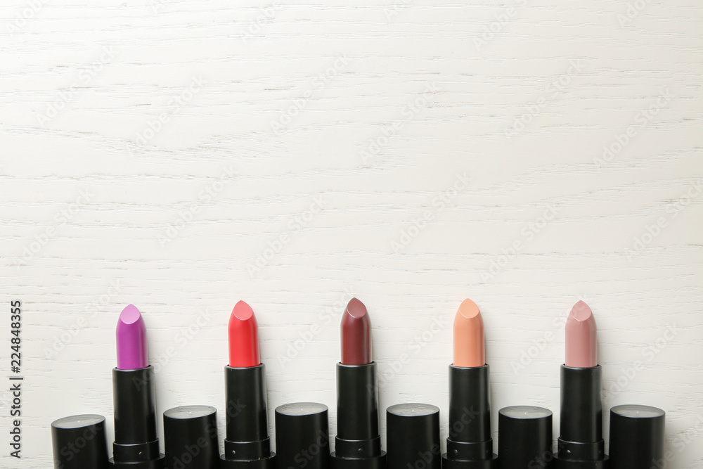 Lipsticks of different shades on light table