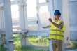 © NDABCREATIVITY - Picture of construction site engineer looking at plan