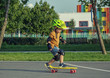 © TheFarAwayKingdom - A little boy enjoys a yellow cruiser penny plastboard