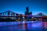 Fototapeta  - Bright glowing bridge in cityscape