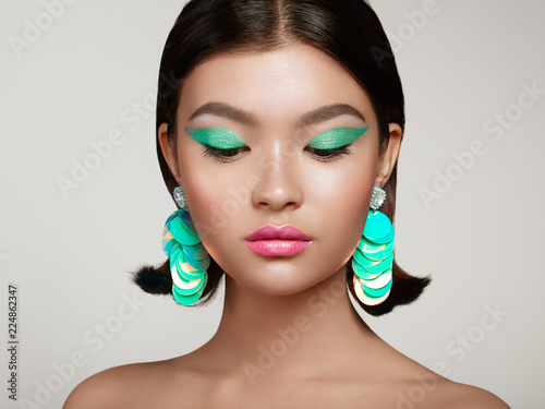 Fotografie, Obraz Beautiful Korean Woman with Large Turquoise Earrings
