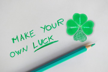 Make your own luck motivational quote with four leaf clover as lucky symbol
