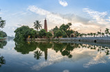Fototapeta Boho - Tran Quoc pagoda during sunset time, the oldest temple in Hanoi, Vietnam. Hanoi cityscape.