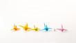 © kardd - Diffirent Mini Size and Color Birds Paper, Font View Origami on White Background