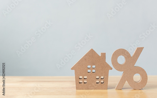 Cuadros en Lienzo Percentage and house sign symbol icon wooden on wood table with white background