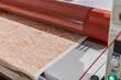 Big red laminator, printing machinery for press and advertising.