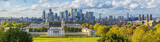 Fototapeta Londyn - ondon, England, Panoramic Skyline View Of Greenwich College and Canary Wharf At Golden Hour Sunset With Blue Sky And Clouds