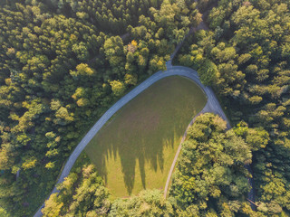 Sticker - Aerial view of road through forest in Switzerland