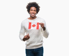 Afro American Man Flag Of Canada Over Isolated Background With A Happy Face Standing And Smiling With A Confident Smile Showing Teeth