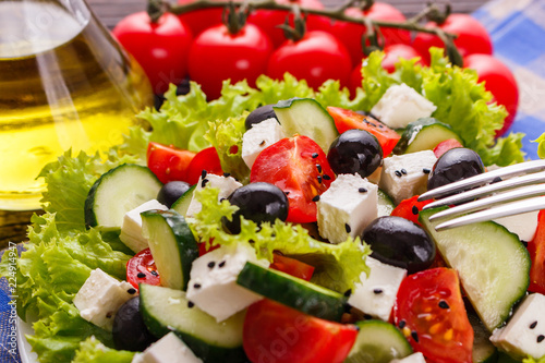 Fotografie, Obraz Greek salad on a wooden rustic background