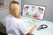 © Andrey Popov - Doctor Video Conferencing On Computer
