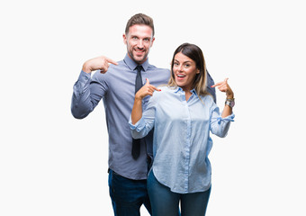 Young workers business couple over isolated background looking confident with smile on face, pointing oneself with fingers proud and happy.