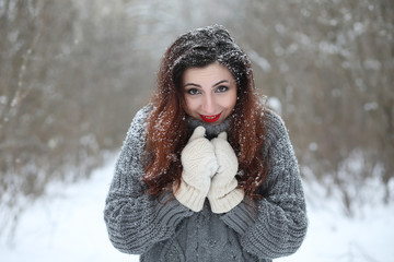 Beautiful girl in a beautiful winter park