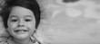 © alexkich - Black and white photo portrait of a young child lying on a pillo
