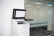 © magneticmcc - White modern laser multi function printer in the office location