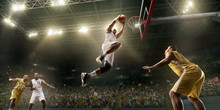 Basketball Players On Big Professional Arena During The Game. Basketball Player Makes Slum Dunk. Bottom View