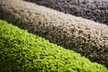 Wall Mural - Set of three different colorful artificial shaggy carpets.