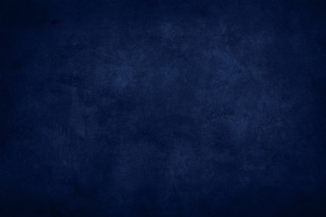 dark blue stained grungy background or texture