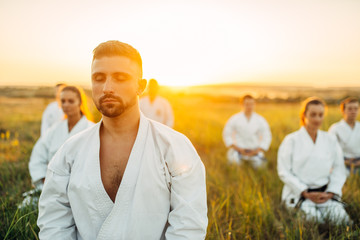 Wall Mural - Karate master on outdoor training with his group