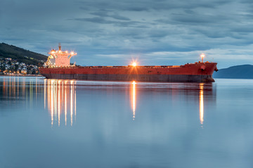 View of a cargo ship anchoring in a port of Narvik to load iron ore, Norway