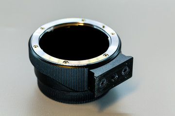 Poster - Lens adapter teleconverter on background, Camera lens adapter for a DSLR