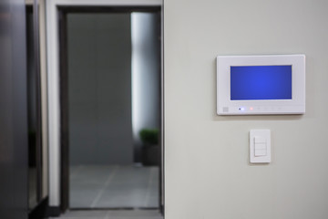 Home interior with a smart home control console or air conditioning setting - remote control touch screen