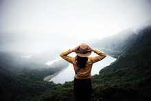 Woman Traveler Holding Hat And Looking At Amazing Mountains And Forest, Wanderlust Travel Concept, Space For Text, Atmospheric Epic Moment, Azores ,portuhal, Ponta Delgada, Sao Miguel
