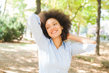 Wall Mural - Happy African Young Woman Relaxed In Nature