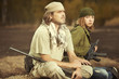 Guerilla, partisan or territory army couple watching around armed with guns