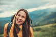 © Yakobchuk Olena - Overjoyed smiling young woman expressing positivity while resting in the mountains