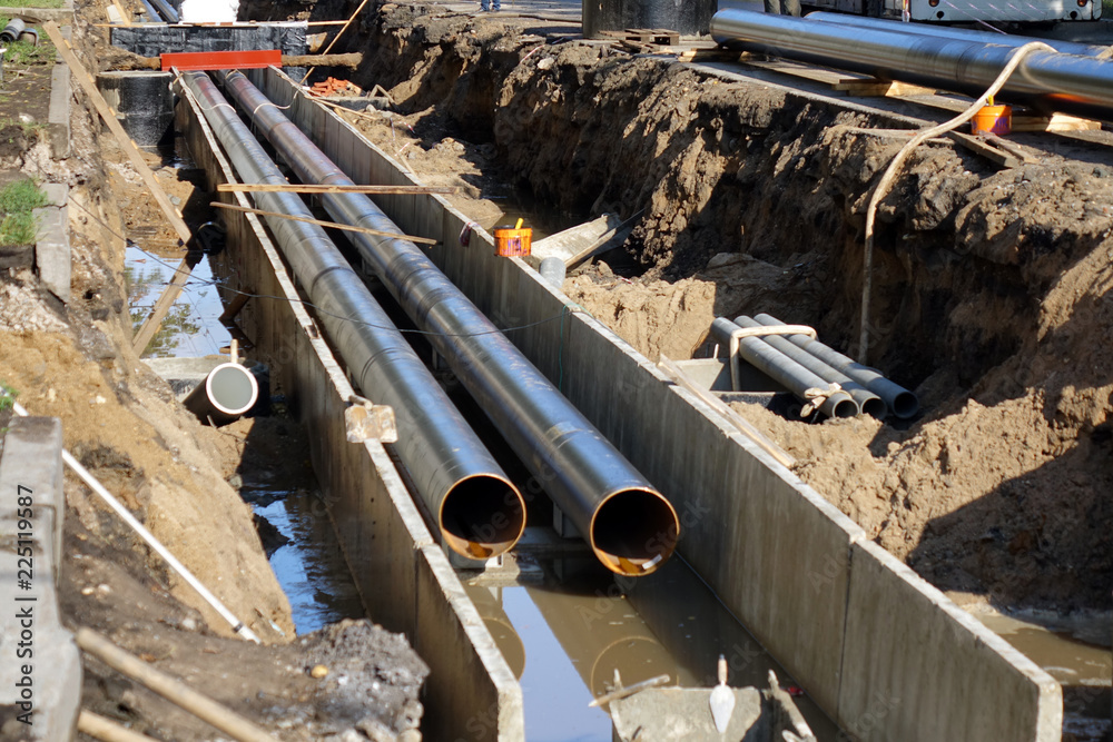 Replacement pipes in the city.Construction of heating mains for ...