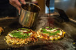 okonomiyaki is almost done on the iron plate