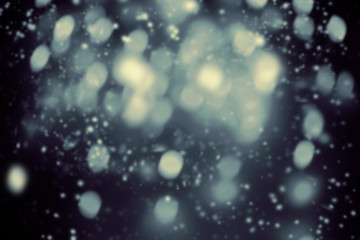 Canvas Print - dark christmas background with snowflakes and glittering bokeh stars. night abstract glowing blurred