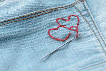 red hearts on jeans trousers