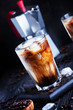 Coffee with ice and milk, brown table, selective focus and shallow DOF