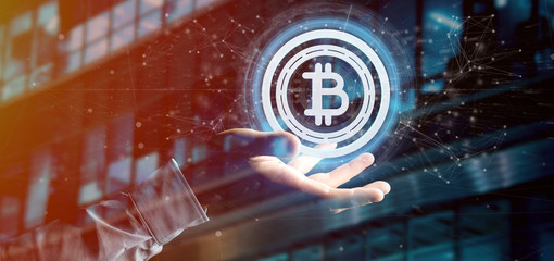 Poster - Man holding a technology Bitcoin icon on a circle 3d rendering