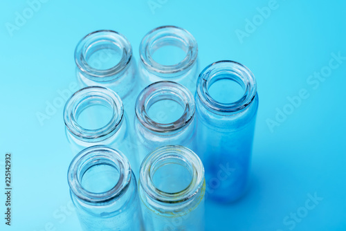 Fotografía Dirty test tubes on blue background medical research.
