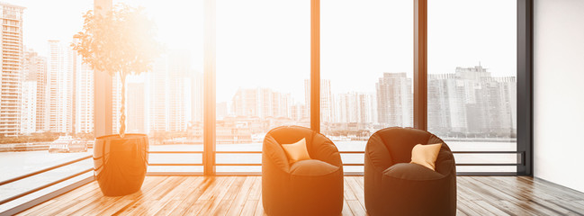 Modern living room containing two chairs and plant