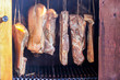 © miro - Smoked bacon hanging in wooden smoker