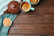Flat Lay Composition With Tea Set On Wooden Background. Space For Text