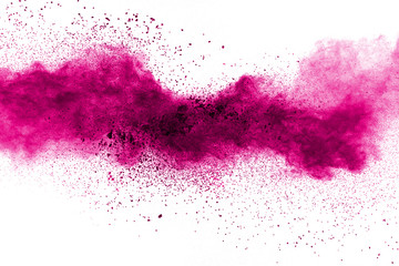 Wall Mural - abstract pink powder explosion on white background. freeze motion of pink dust splattered.