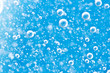© assistant - Bubbles of oxygen under water. Water blue structure. Macro