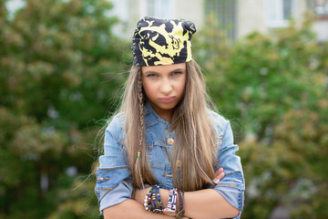 Upset gloomy young woman looking at camera