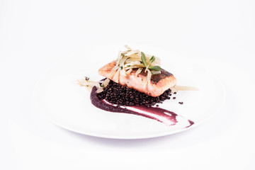 Sticker - Baked salmon, beetroot mousse, black lentils and pear on a white background